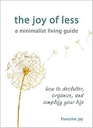 The book cover for The Joy of Less, A Minimalist Living Guide: How to Declutter, Organize, and Simplify Your Life; a dandelion flower with spuds floating in the breeze.