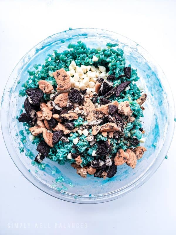 White chocolate chips, oreos and chips ahoy cookies added to Cookie monster crispy treats. 