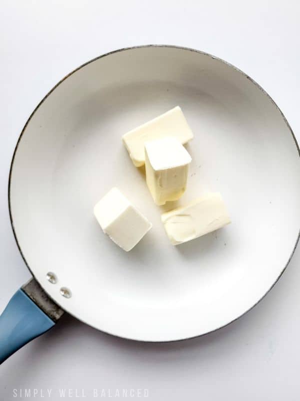 Cubes of butter melting in a pan. 
