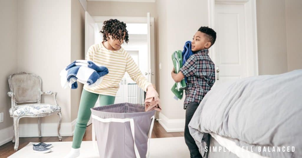 Siblings working together to put away laundry. Household chores teach responsibility and important life skills. 