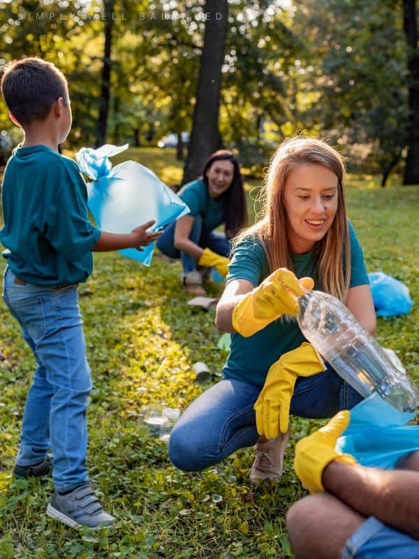 Family doing community service project to teach kids about gratitude and helping others.