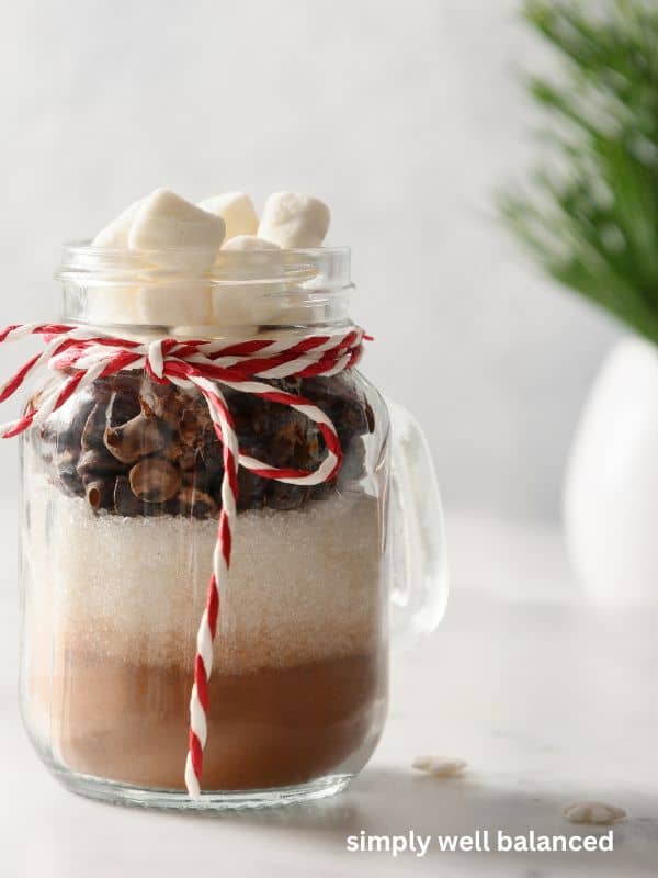 Hot chocolate mix packaged in a glass mug for an edible Christmas Gift Exchange. 