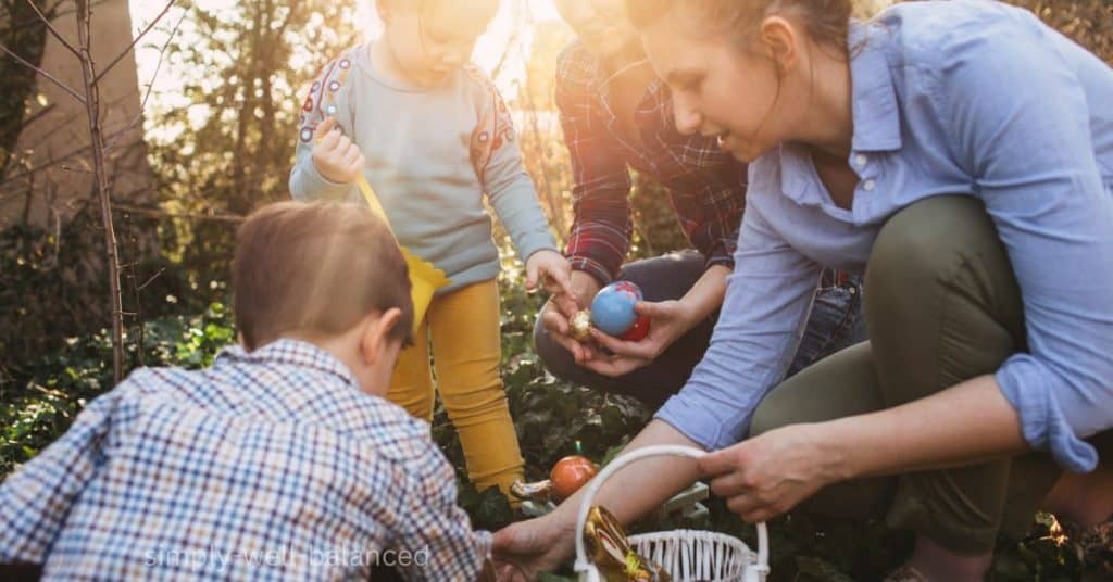 Family Easter Egg hunting plastic eggs filled with gifts. 