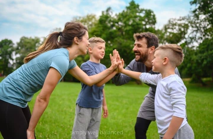  A family getting fit and exercising together outside