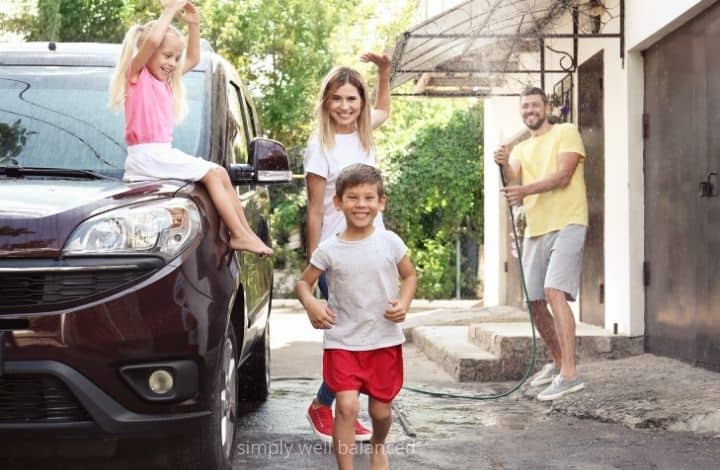 Family washing the car together.