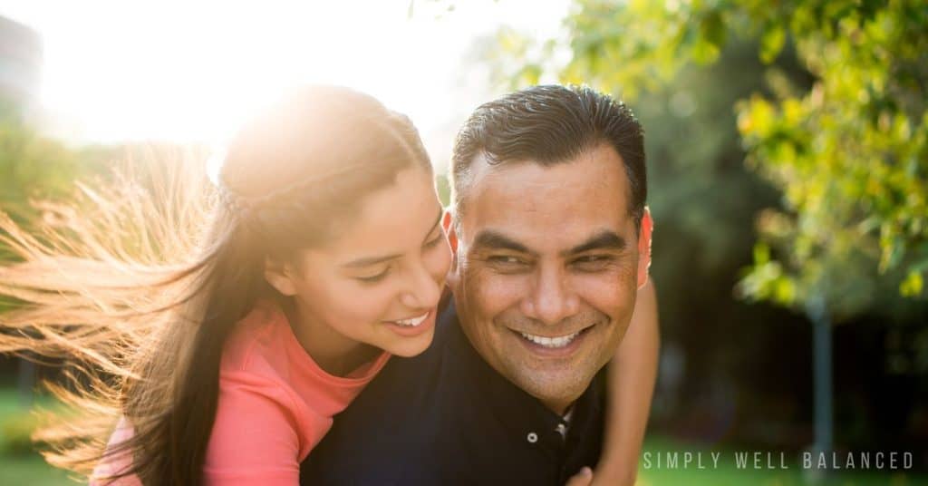 Father and teenager daughter doing an outdoor activity.