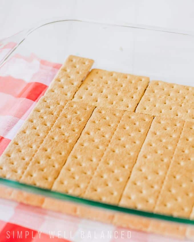 A layer of graham crackers in a glass 9X13 dish to make a patriotic icebox cake. 