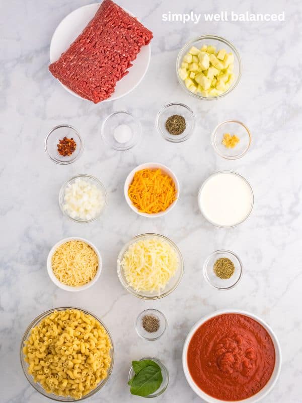 Ingredients on a kitchen counter to make a zucchini and ground beef bake. 
