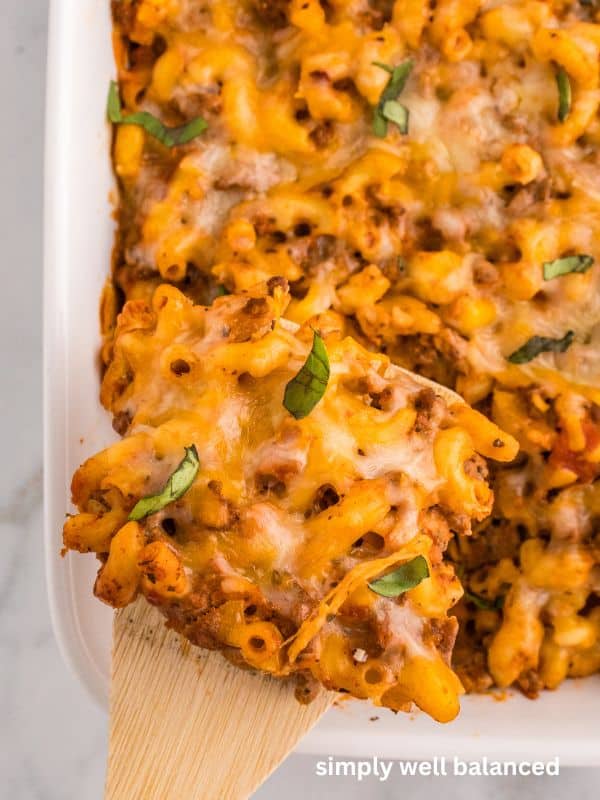 A serving of zucchini beef casserole on a spatula. 