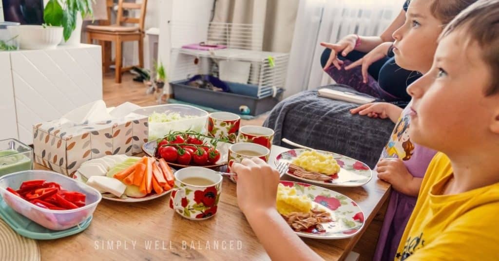 Kids at home for summer vacation eating breakfast and watching TV. 