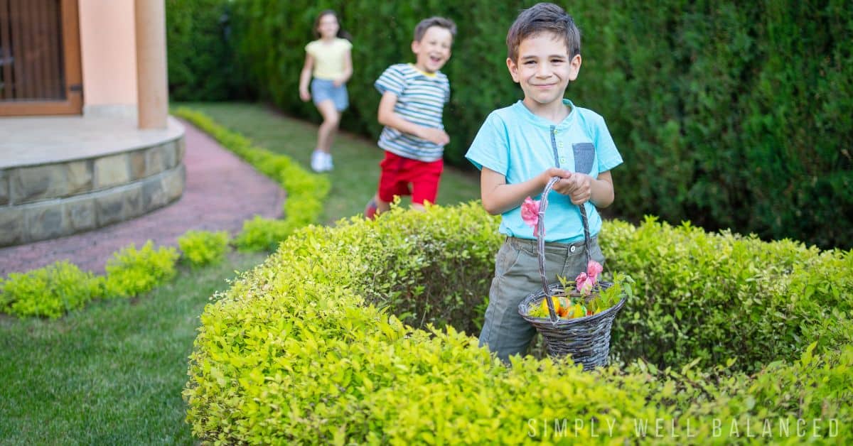 Kids finding Easter Eggs hidden in bushes in their yard.