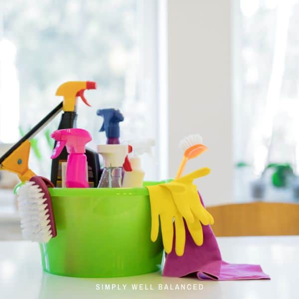 An organized caddy of kitchen cleaning supplies.