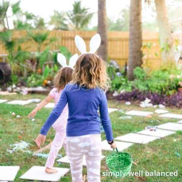 Little girls Easter Egg Hunting. Plastic Egg fillers.