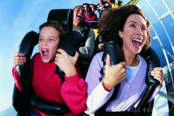 Mother and son riding a roller coaster