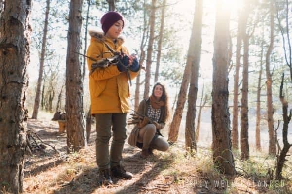 Mother Son Date Idea | Mother and son building a campfire as they set up camp. 