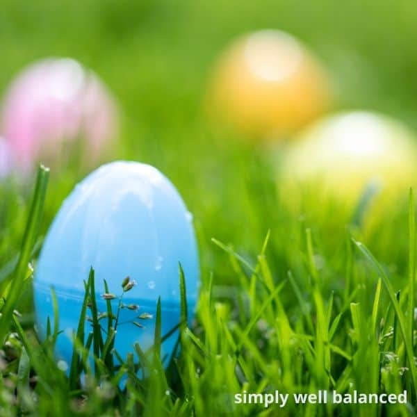 Close up of pastel  plastic Easter Eggs hidden in the grass. 