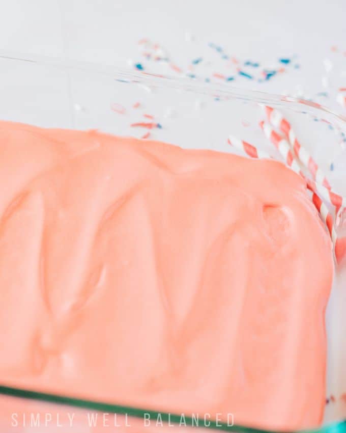 Layer of red cool whip for the patriotic icebox cake. 