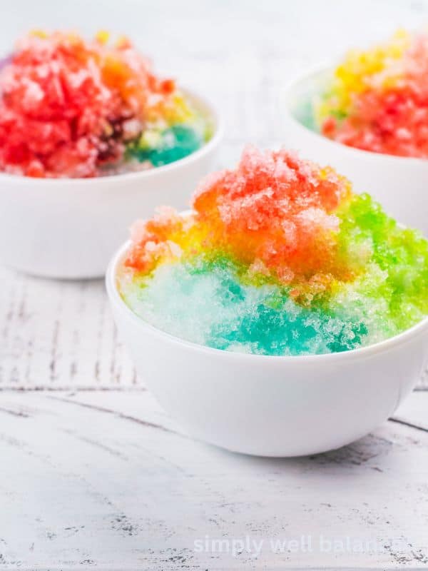 DIY Rainbow shaved ice in white bowls - Screen-free summer activity for kids. 