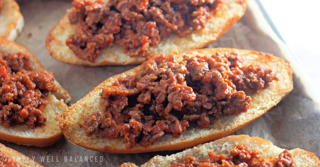 Baked spaghetti bread topped with meat sauce. 