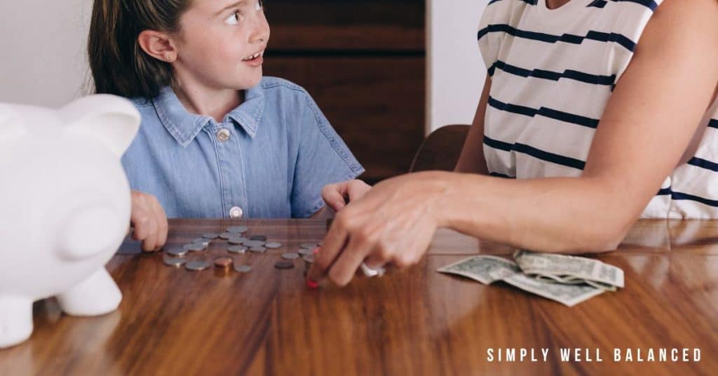 Mom teaching her daughter to count and save money. Important life skills: Money Management