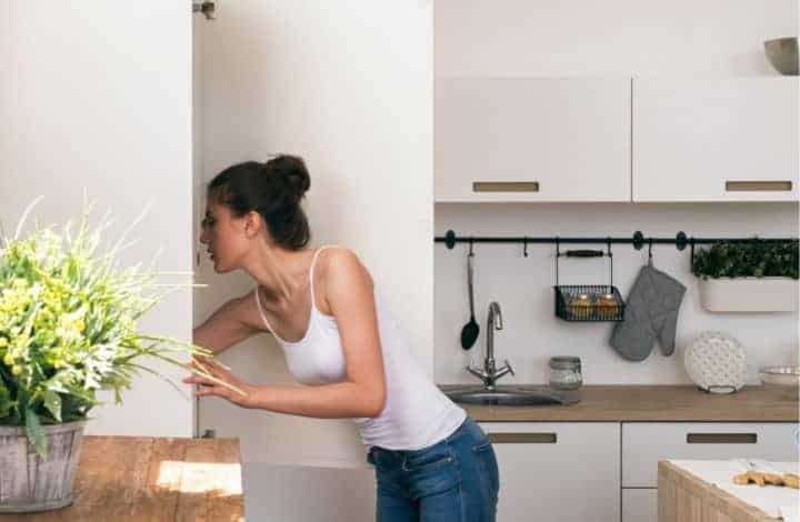 Woman looking in pantry