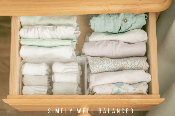 Perfectly folded clothes in a dresser drawer, using convenient drawer organizers.
